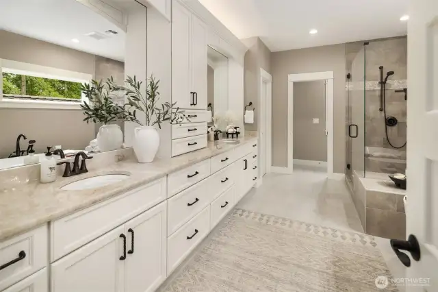Spa inspired luxury bath with soaking tub, large shower, gas fireplace, and huge walk in closet.