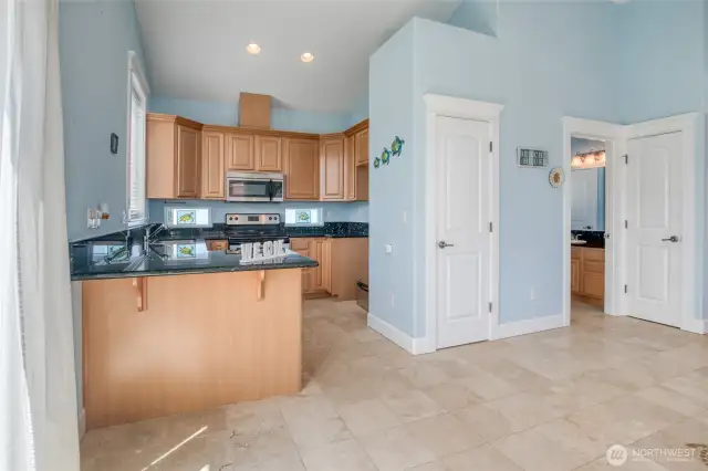 Kitchen features granite countertops and stainless steel appliances.
