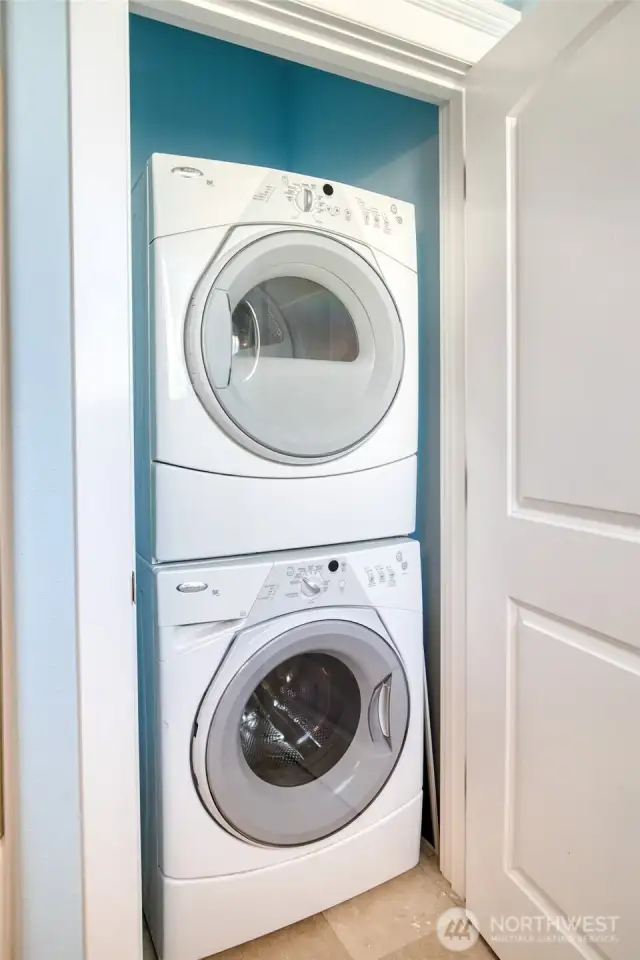 Stacked laundry is also in the bathroom.