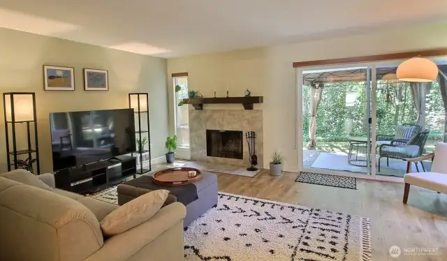 Spacious living room filled with natural light, offering an open and inviting layout perfect for relaxing or entertaining.