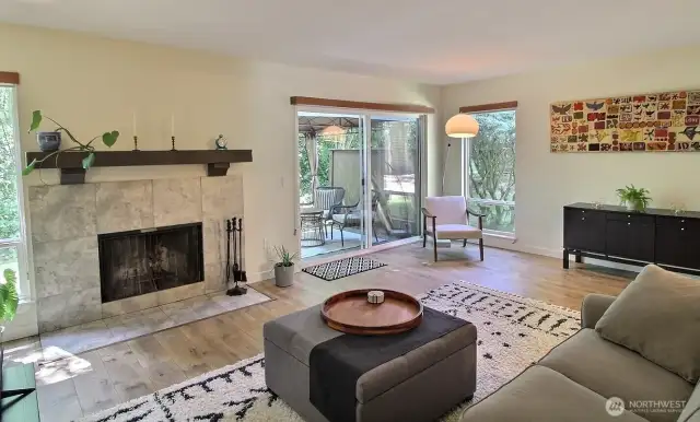 Cozy up next to the charming wood-burning fireplace—a beautiful focal point that adds warmth and character to the space.