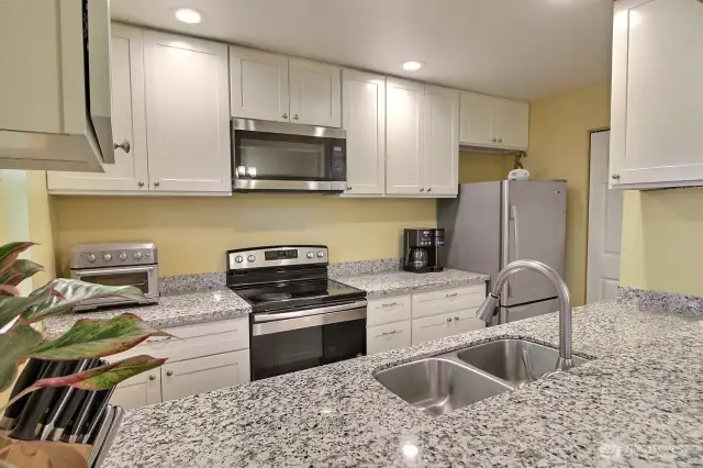 Convenient breakfast bar adds extra seating and a casual dining option with a great view of the kitchen and second patio.