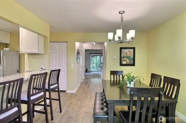 Open and airy dining room featuring generous space and large windows that fill the area with natural light.