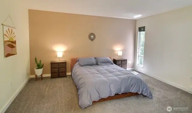 Big windows showcase calming views of the nearby beautiful woodlands.