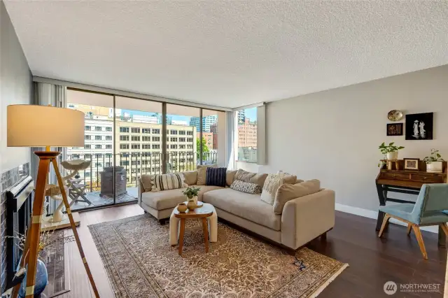 Open floor plan enhances the generous living room, featuring a beautiful gas fireplace.