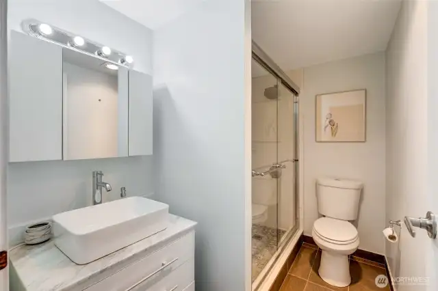 Updated bathroom featuring modern fixtures and finishes.