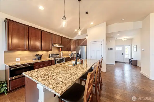 Entry onto Main level leads to Eat In Kitchen with Center Island and Pantry