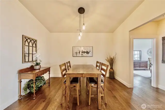 Main level dining area across from the kitchen island
