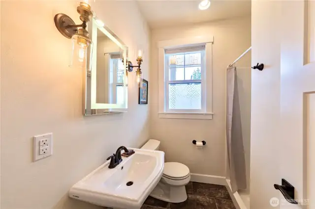 Main level 3/4 bathroom that has a shower.
