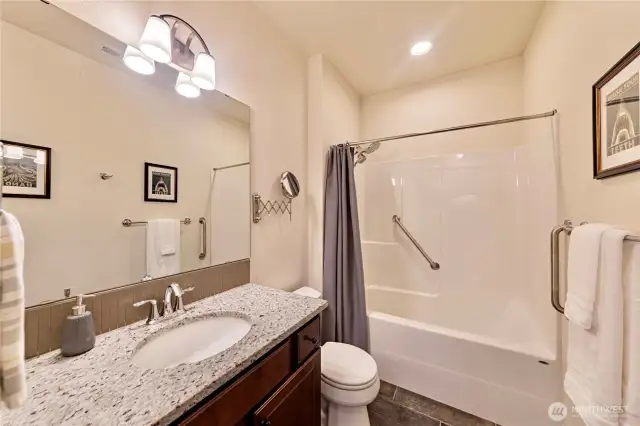 Downstairs spacious full size bathroom with tub