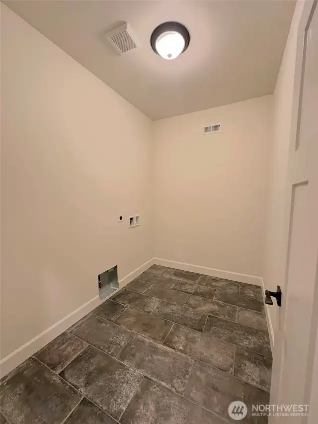 Downstairs FULL SIZE side by side laundry room with extra space