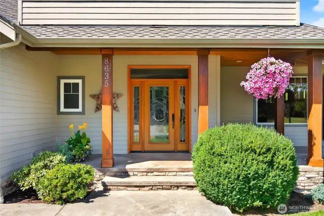 Grand entry with leaded glass doors and side lights