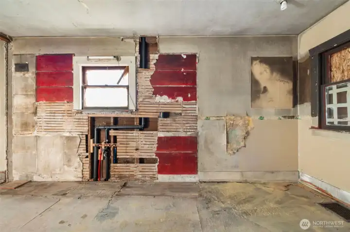 Kitchen area offers roughed-in plumbing and a spot perfect for casual dining.