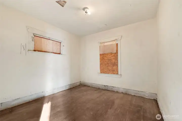Bedroom #2 features classic hardwood flooring.