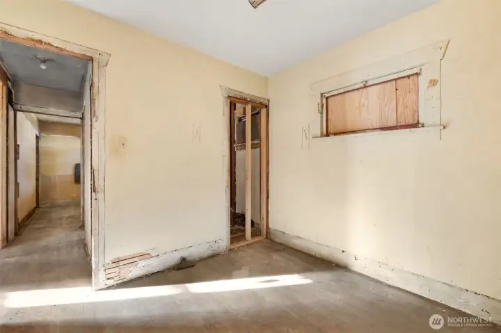 Bedroom #2 offers natural light through a privacy window