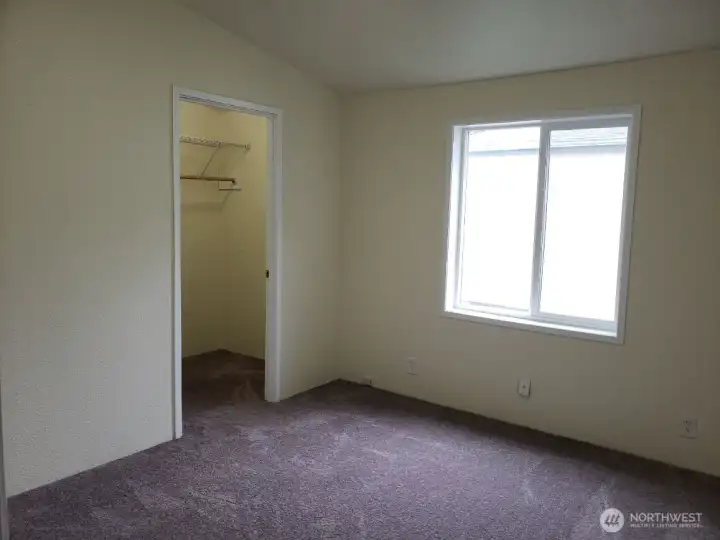 Third Bedroom has a Walk In Closet, Newer Interior Paint and Carpeting.