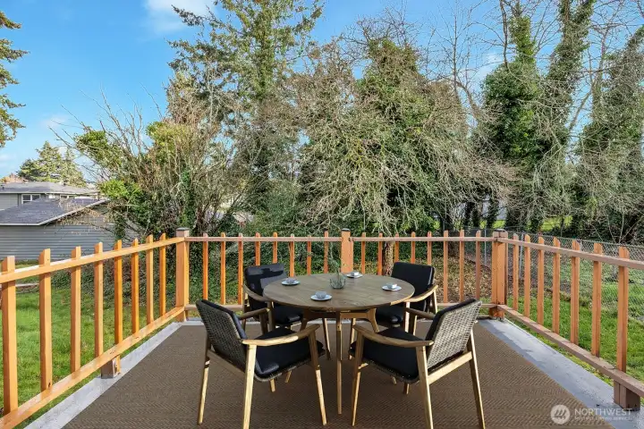 Slider access door to the back deck. Sit out here and enjoy the sounds of nature or watch the kids play.                 Virtually staged.