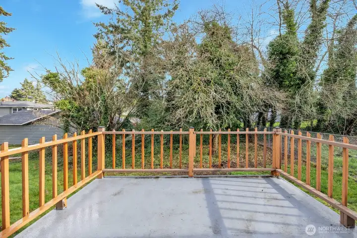Another view of the back deck. Room for barbeque and additional outdoor furniture.