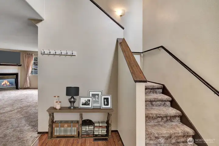Hardwood in the entry foyer. Room for Coat Tree or sitting bench.   Virtually staged.
