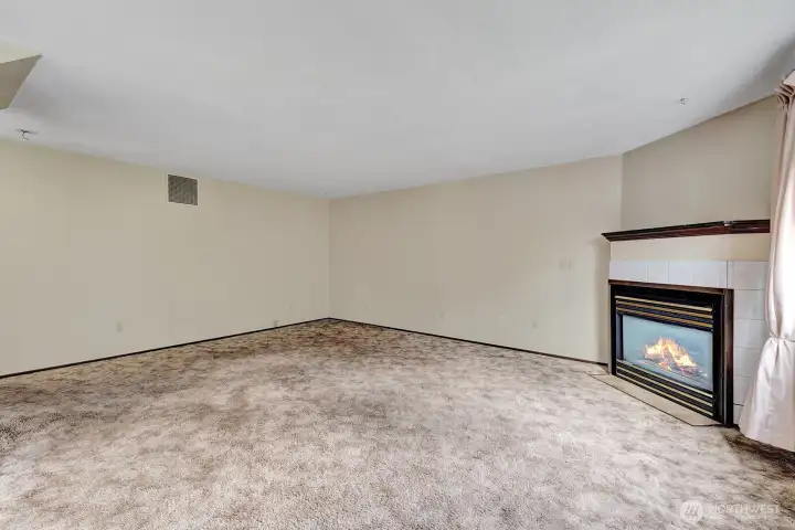 Another view of the family room. Gas fireplace with mantel.