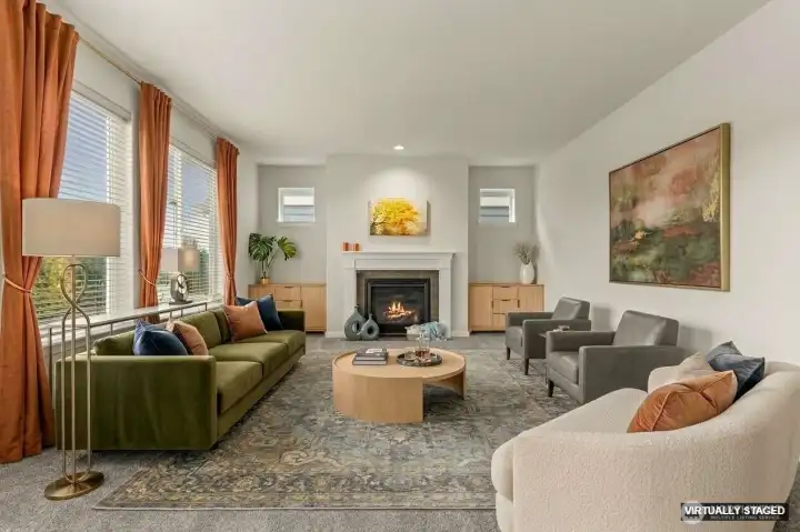 Great room with gas fireplace with wall of windows