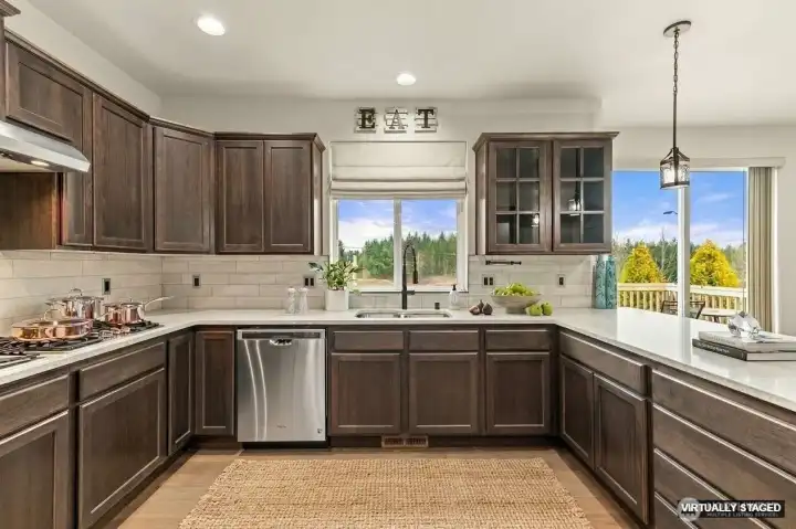 Kitchen with eating bar overlooking the back yard