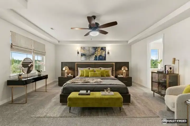Primary bedroom with tray ceiling and wall of windows