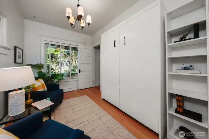 Main floor sitting room/4th bedroom. Murphy bed stays
