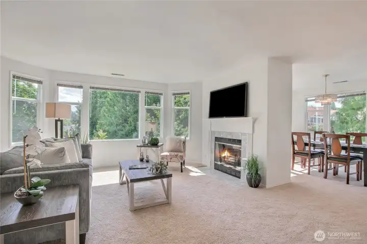 Open living/dining features f/p with custom mantel.