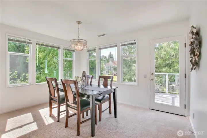 Dining Room flooded with natural light with door to deck.