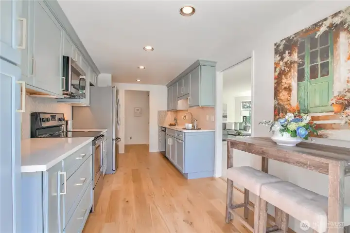 Lots of counter and cabinet space. Pantry with pull-outs.