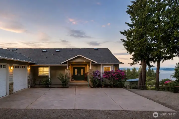 Additional 2 car garage with extra space for storage or workbenches sits just off the main entrance. Additional 2 car garage with extra space for storage or workbenches sits just off the main entrance.