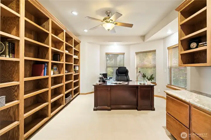 Just off the entry, a large office space with built-in bookshelves and lots of natural light. Just off the entry, a large office space with built-in bookshelves and lots of natural light.