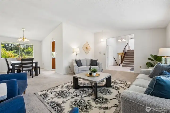 Filled with natural light and offering easy access to the kitchen and entry, this inviting space is ideal for both everyday comfort and entertaining guests.
