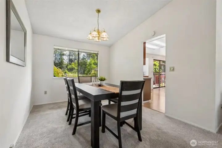 The spacious dining room flows seemlessly between the living room & kitchen.