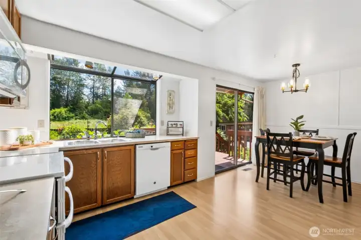 - The adjoining eating area boasts plenty of room for your breakfast table, while the slider conveniently takes you out the deck for easy summer entertaining!