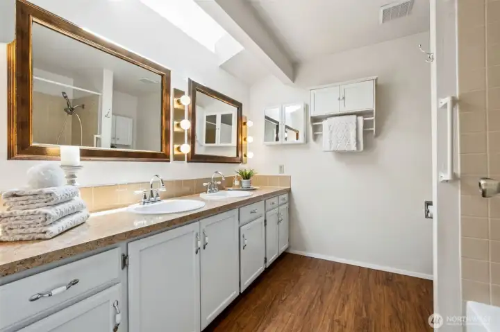 - The attached full bath includes plenty of cabinets & double sinks
