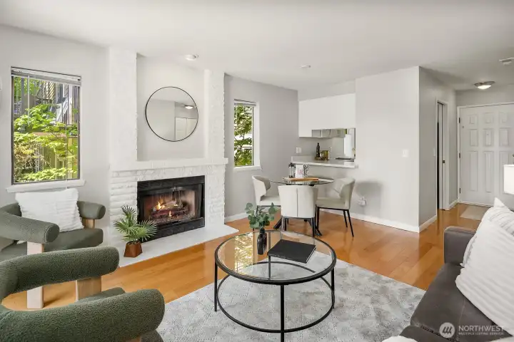 Warm toned hardwood floors and a pass through to the kitchen.