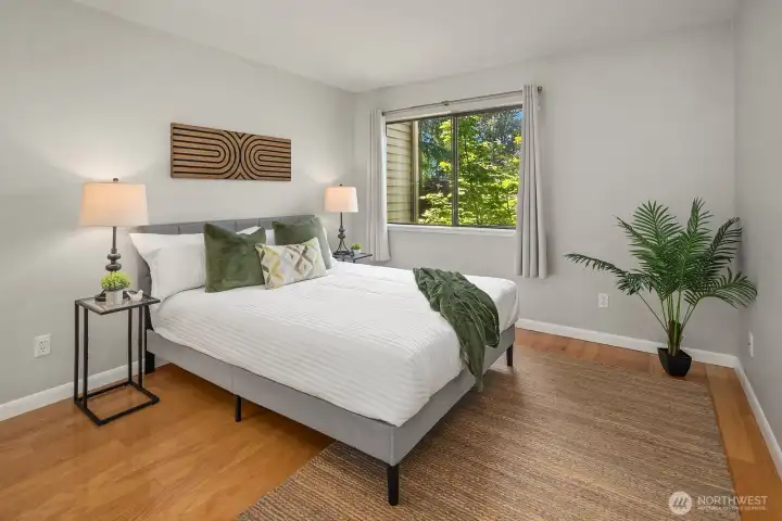 A private bedroom with a serene treetop view.