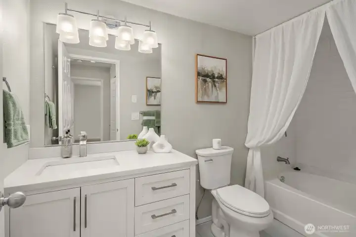 Enjoy your full-size soaking tub and updated bathroom with quartz countertops and undermount sink.