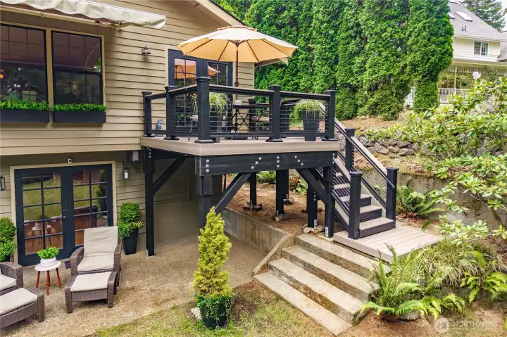 Deck has composite decking, a motorized window awning and window flower boxes.
