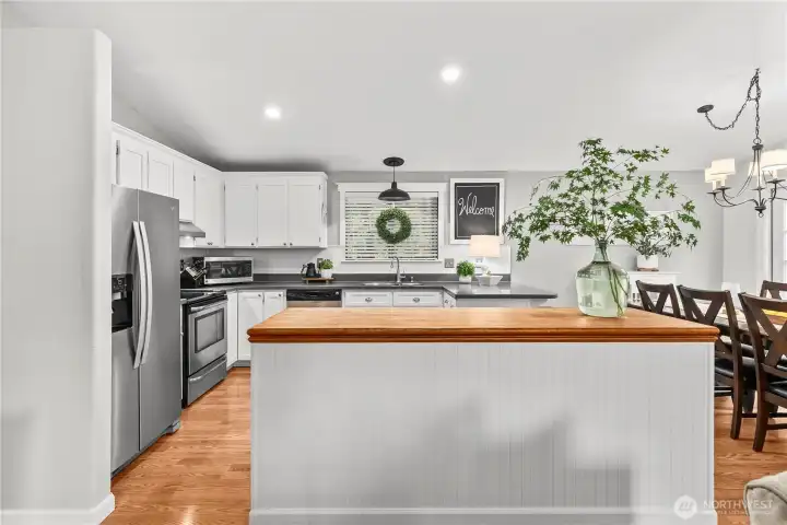 Updated kitchen with stainless steel appliances.