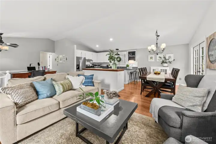 Main living room with open concept kitchen, dining and living.