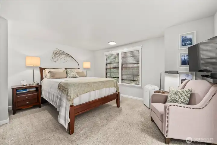 Primary bedroom with en suite bath and walk-in closet.