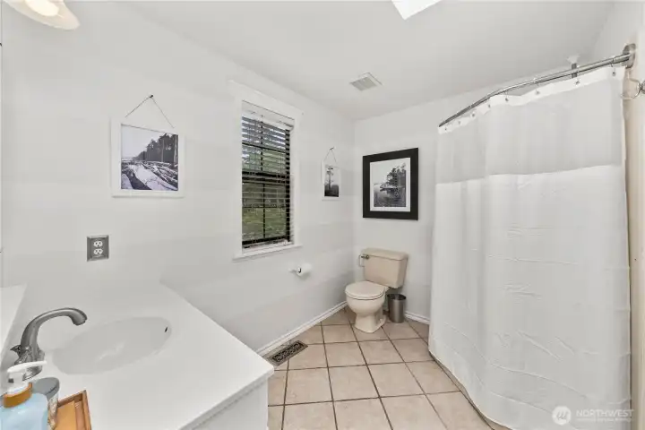 Shower bath in the primary suite.