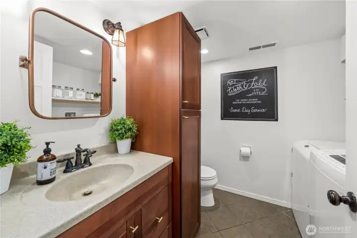 Lower level half bath with laundry.