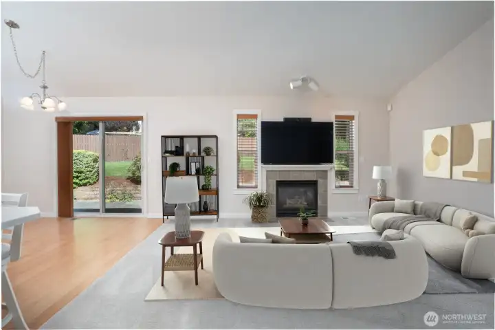 Straight ahead is the wide open & bright family room, kitchen and dining space. Staging is virtual