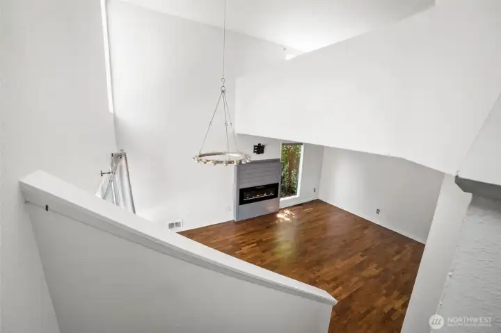 View of living room from upper level of stairway.