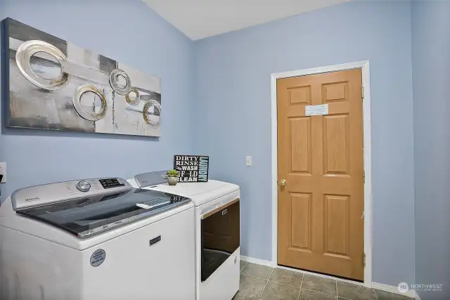 Large laundry room with access to the 3 car garage.