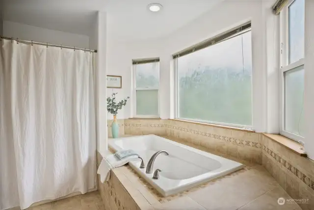 Oversized soaking tub to sink into and forget all the cares of the world.